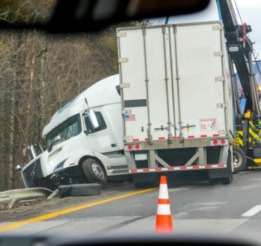 Truck dashboard with a dash cam recording the road for insurance claim protection.