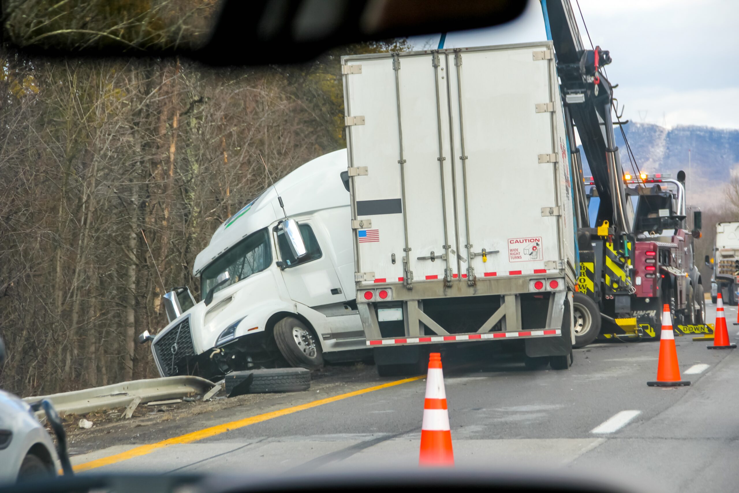 Truck dashboard with a dash cam recording the road for insurance claim protection.