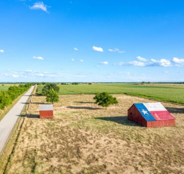 Semi-truck driving through rural Arkansas roads, symbolizing regional trucking insurance needs