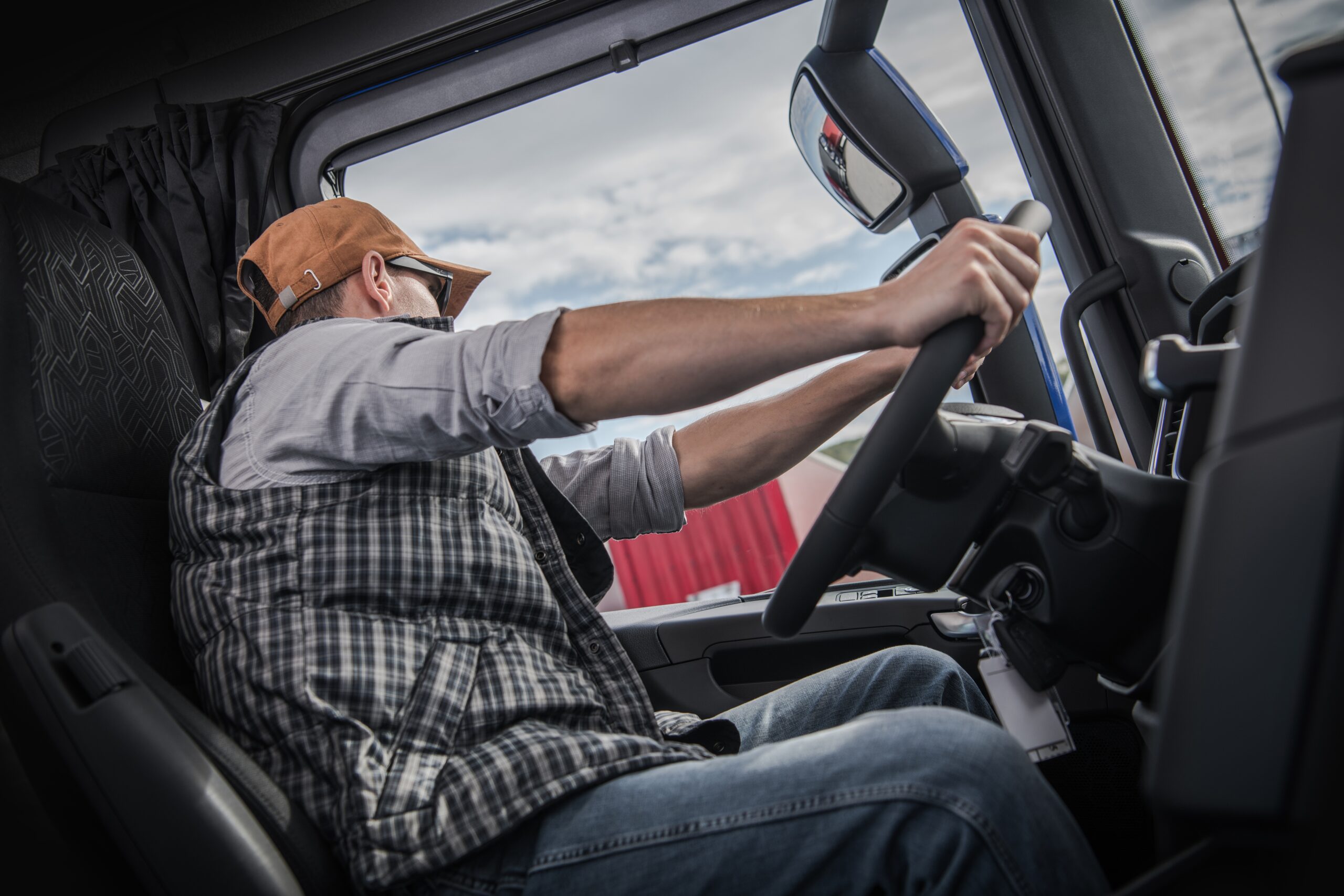 Truck driver operating a commercial truck safely during peak holiday freight season with focus on safety and risk reduction