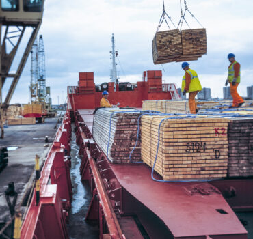 Heavy haul truck transporting oversize construction equipment representing specialized transport insurance