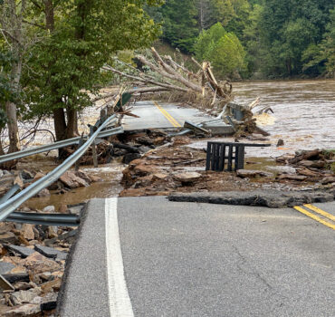 semi truck driving through storm in Oklahoma with heavy rain and lightning